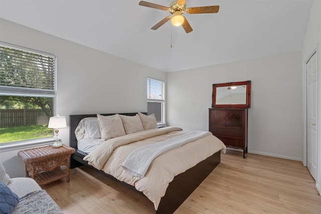 208 Meadowside Dr, Hutto, TX 78634 - bedroom with light wood-style floors, vaulted ceiling, and ceiling fan