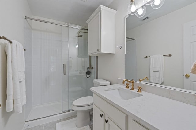 208 Meadowside Dr, Hutto, TX 78634 - bathroom featuring a stall shower, vanity, and tile patterned flooring