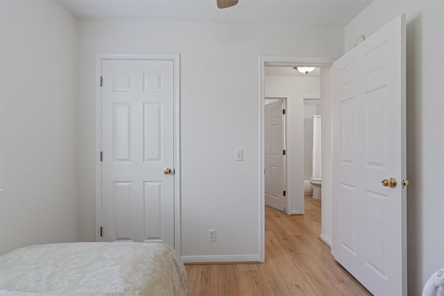 208 Meadowside Dr, Hutto, TX 78634 - bedroom with light wood-style floors and baseboards