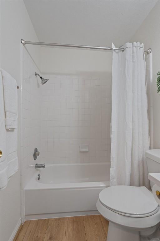 208 Meadowside Dr, Hutto, TX 78634 - bathroom with wood finished floors and shower / tub combo with curtain