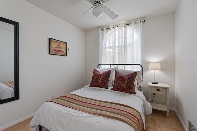208 Meadowside Dr, Hutto, TX 78634 - bedroom featuring light wood-style floors and ceiling fan