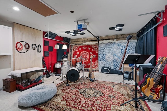 208 Meadowside Dr, Hutto, TX 78634 - game room featuring attic access, a garage, and carpet