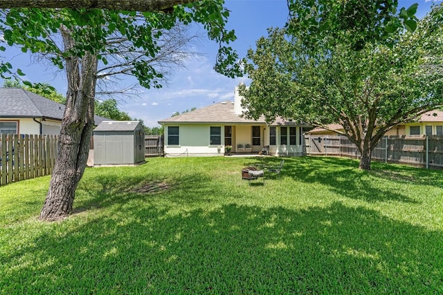 208 Meadowside Dr, Hutto, TX 78634 - rear view of house with a storage shed, a fenced backyard, a patio, and stucco siding