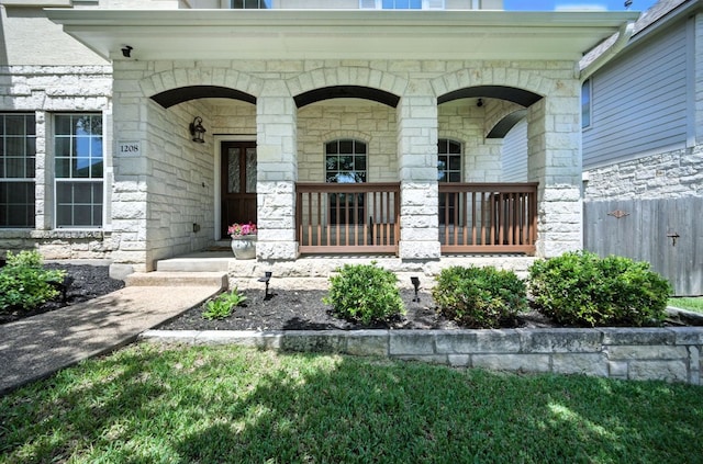 1208 Pine Forest Cir, Round Rock, TX 78665 - view of exterior entry with stone siding and covered porch