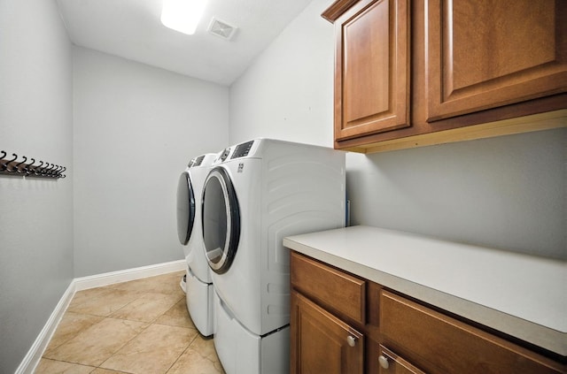 1208 Pine Forest Cir, Round Rock, TX 78665 - laundry area featuring washer and clothes dryer, cabinet space, and light tile patterned floors