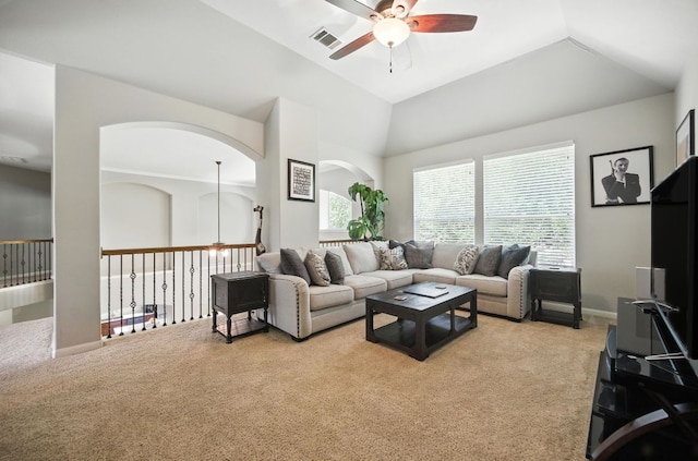 1208 Pine Forest Cir, Round Rock, TX 78665 - living room featuring ceiling fan, carpet flooring, lofted ceiling, and arched walkways