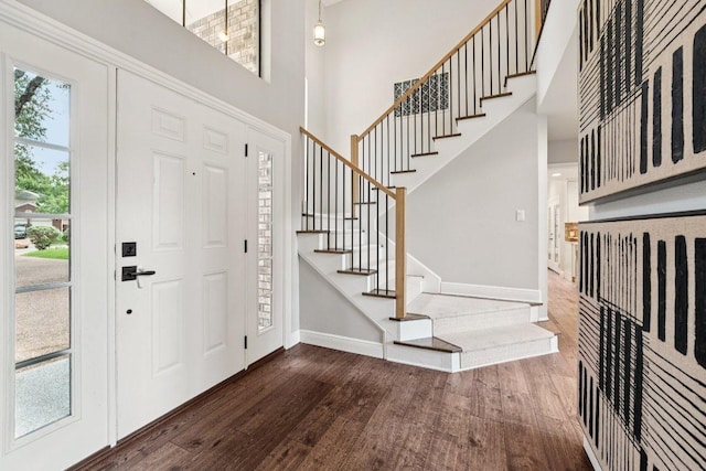 7204 Guava Cv, Austin, TX 78750 - entryway featuring dark wood-type flooring, a high ceiling, and stairway