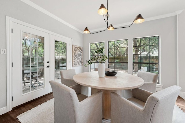 7204 Guava Cv, Austin, TX 78750 - dining space with dark wood finished floors, crown molding, and french doors