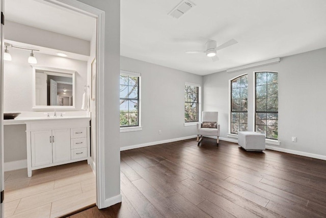 7204 Guava Cv, Austin, TX 78750 - sitting room with ceiling fan and wood finished floors
