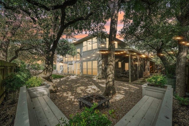 7204 Guava Cv, Austin, TX 78750 - view of yard featuring a fire pit and a sunroom