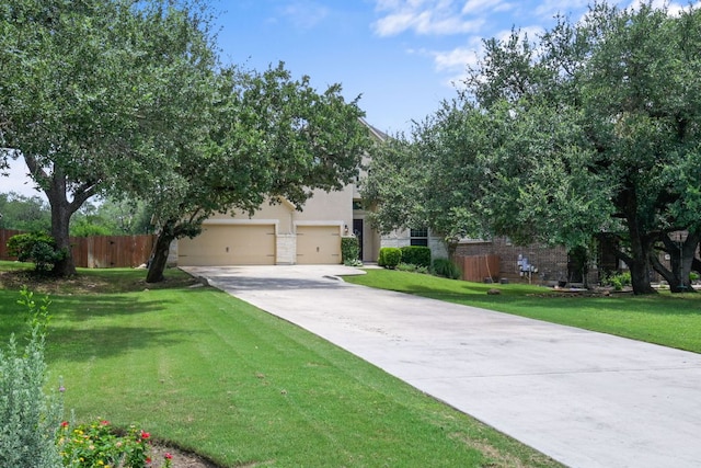 30872 Schlather Ln, Bulverde, TX 78163 - obstructed view of property with driveway, an attached garage, and stucco siding