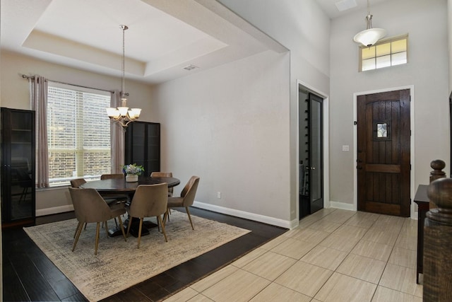 30872 Schlather Ln, Bulverde, TX 78163 - dining room with a chandelier, healthy amount of natural light, a high ceiling, and a tray ceiling