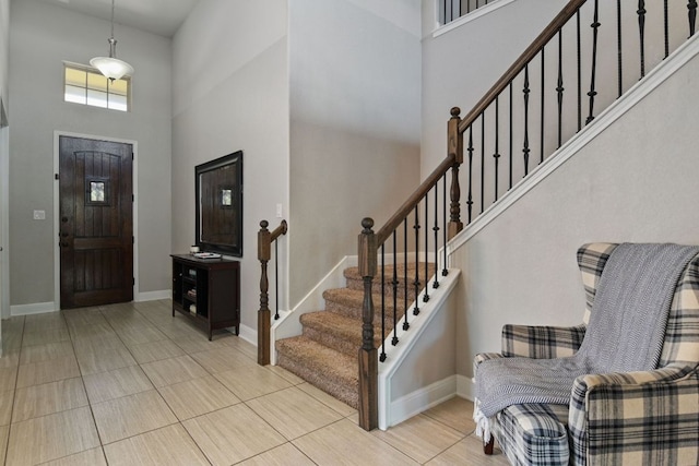 30872 Schlather Ln, Bulverde, TX 78163 - tiled foyer with a high ceiling and stairway