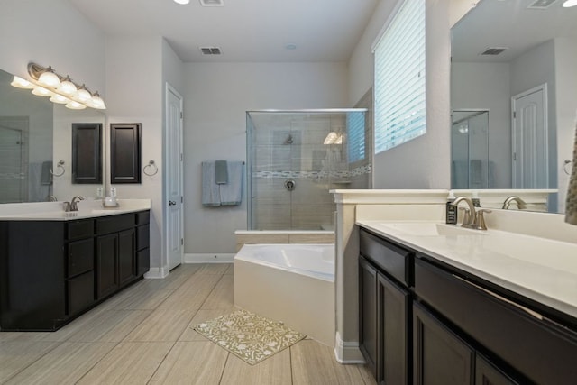 30872 Schlather Ln, Bulverde, TX 78163 - bathroom with a shower stall, a garden tub, and two vanities