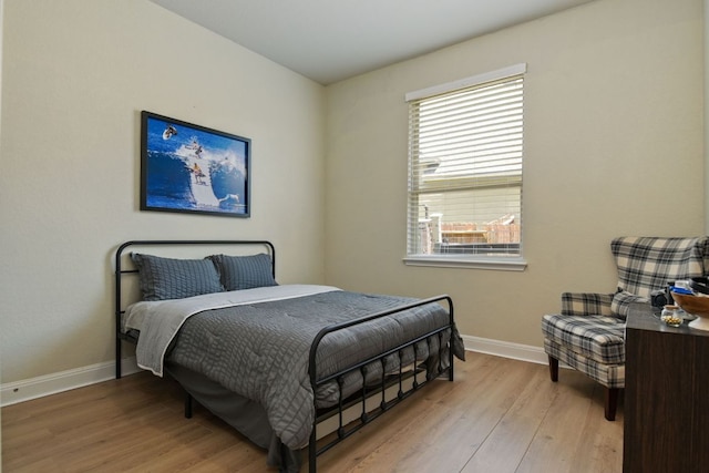 30872 Schlather Ln, Bulverde, TX 78163 - bedroom with wood finished floors and multiple windows