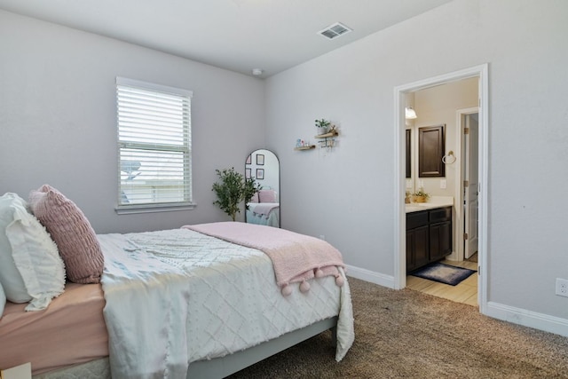 30872 Schlather Ln, Bulverde, TX 78163 - bedroom featuring light colored carpet and connected bathroom