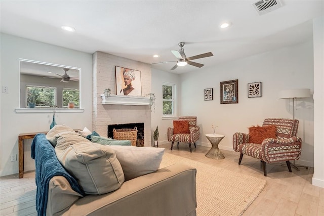 10133 Oliver Dr, Austin, TX 78737 - living room with a ceiling fan, plenty of natural light, recessed lighting, and a brick fireplace