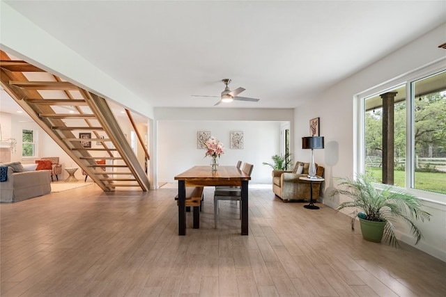 10133 Oliver Dr, Austin, TX 78737 - dining room featuring stairway, light wood-type flooring, and ceiling fan