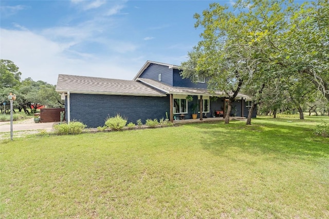 10133 Oliver Dr, Austin, TX 78737 - view of front of property featuring a front lawn and covered porch