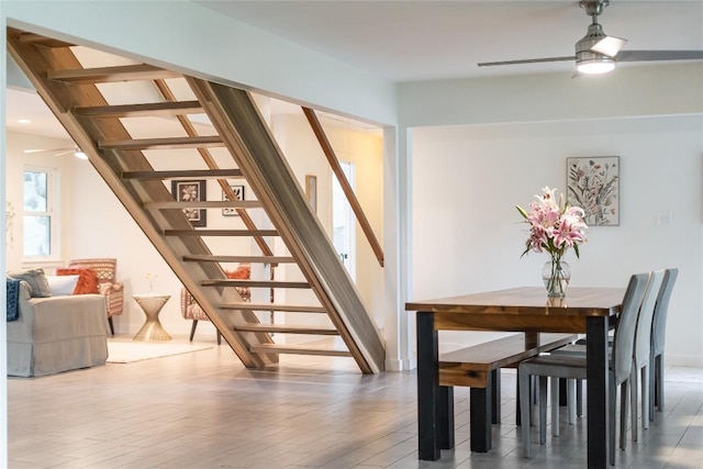 10133 Oliver Dr, Austin, TX 78737 - dining area featuring stairway, a ceiling fan, and wood finished floors