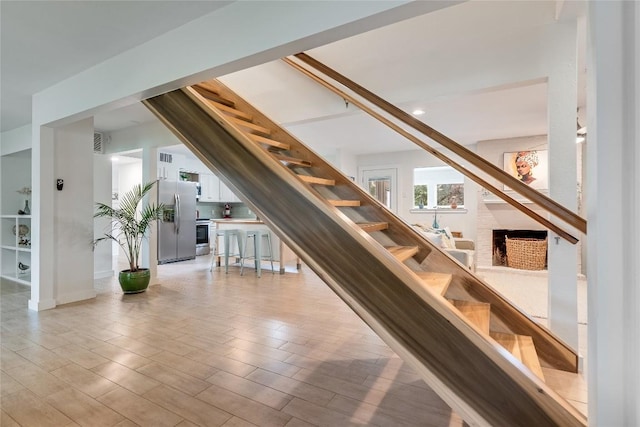 10133 Oliver Dr, Austin, TX 78737 - staircase featuring wood finished floors