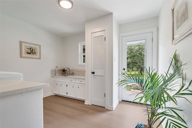 10133 Oliver Dr, Austin, TX 78737 - corridor featuring light wood-style flooring and a sink