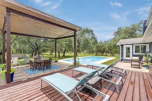 10133 Oliver Dr, Austin, TX 78737 - deck with outdoor dining area, an outdoor pool, ceiling fan, and a patio area