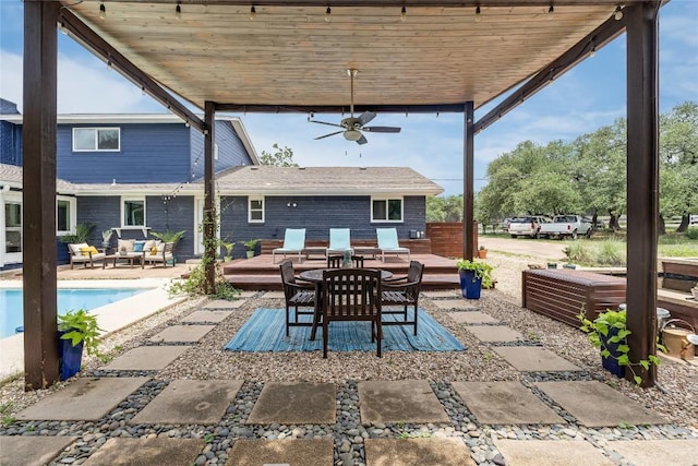 10133 Oliver Dr, Austin, TX 78737 - view of patio / terrace with a wooden deck, an outdoor pool, a ceiling fan, and outdoor dining area