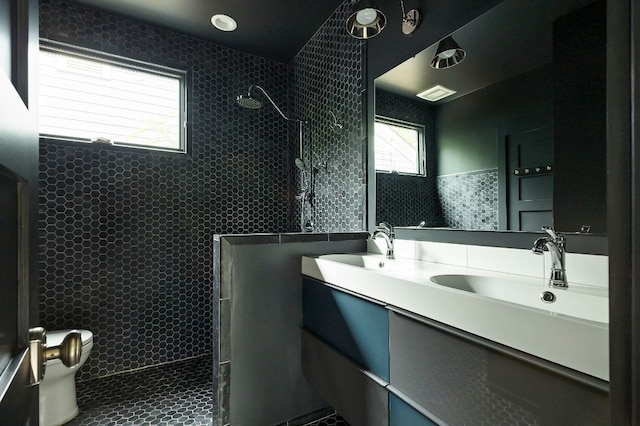 913 Christopher St, Austin, TX 78704 - bathroom featuring walk in shower and double vanity