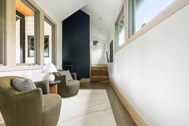 913 Christopher St, Austin, TX 78704 - sitting room featuring wood finished floors, lofted ceiling, and stairway