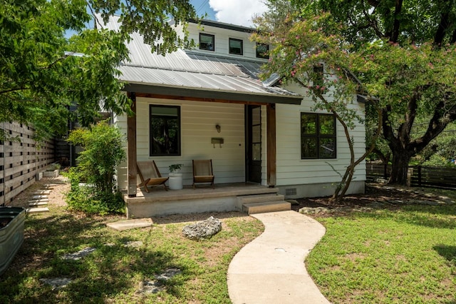 913 Christopher St, Austin, TX 78704 - view of front of home featuring a porch and a metal roof