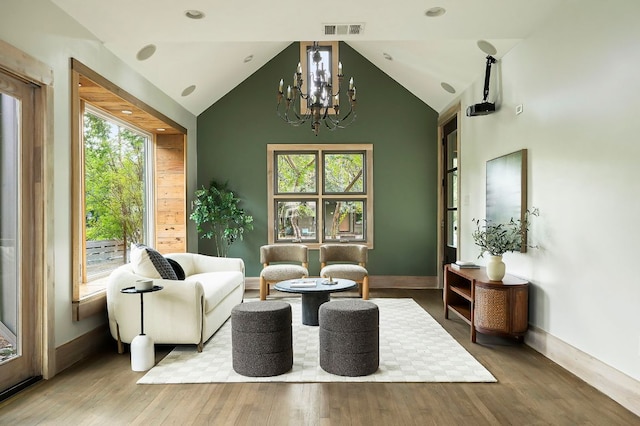 913 Christopher St, Austin, TX 78704 - living room with a chandelier, wood finished floors, and high vaulted ceiling