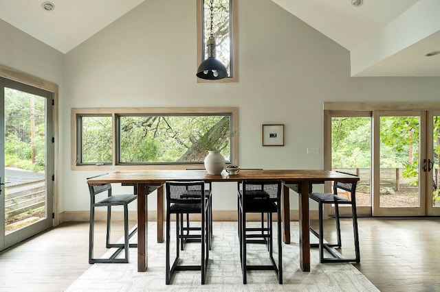 913 Christopher St, Austin, TX 78704 - dining room with high vaulted ceiling and light wood-style floors