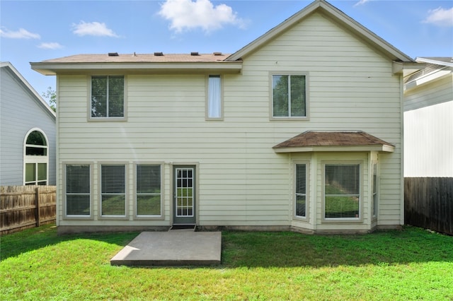 12007 Sky W Dr, Austin, TX 78758 - back of property with a fenced backyard and a patio