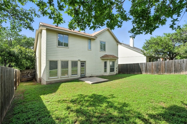 12007 Sky W Dr, Austin, TX 78758 - rear view of property with a fenced backyard and a patio area