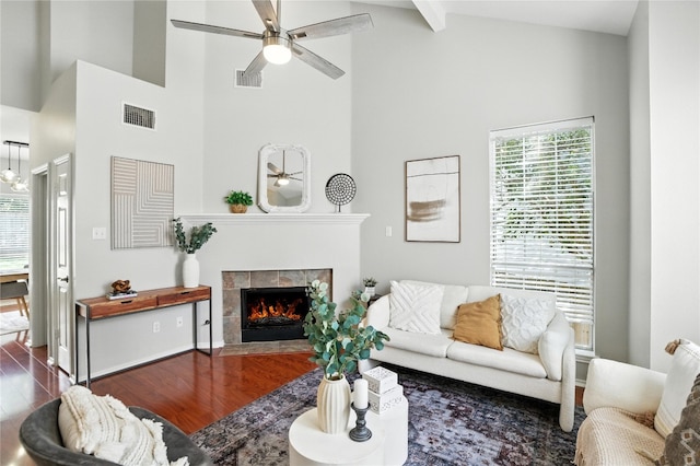 12007 Sky W Dr, Austin, TX 78758 - living area featuring ceiling fan, wood finished floors, healthy amount of natural light, and high vaulted ceiling
