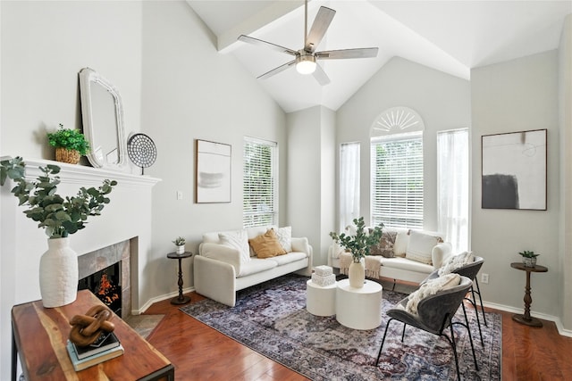 12007 Sky W Dr, Austin, TX 78758 - living area with ceiling fan, lofted ceiling, wood finished floors, and a tiled fireplace