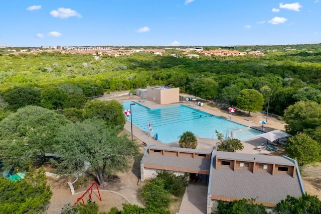 12007 Sky W Dr, Austin, TX 78758 - drone / aerial view of a pool and a heavily wooded area