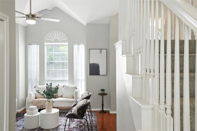 12007 Sky W Dr, Austin, TX 78758 - living area with ceiling fan, wood finished floors, vaulted ceiling, and stairs