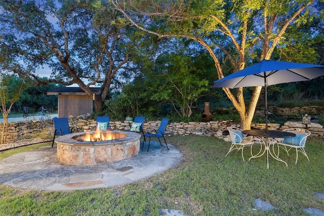 11420 Rim Rock Trl, Austin, TX 78737 - view of green lawn with a fire pit and a patio area