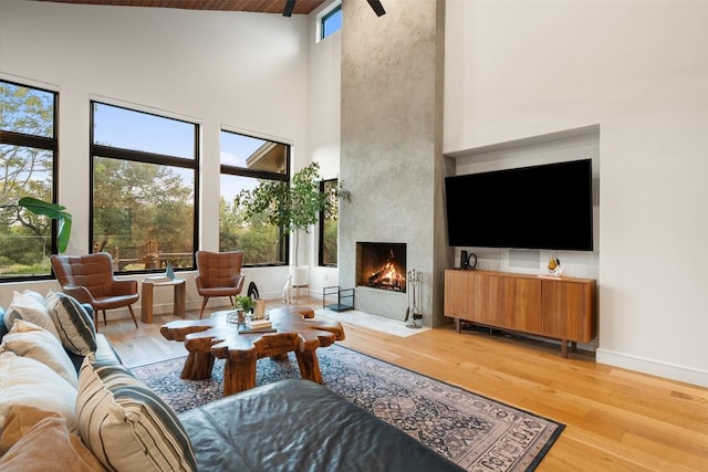 11420 Rim Rock Trl, Austin, TX 78737 - living area with high vaulted ceiling, light wood-style flooring, and a fireplace