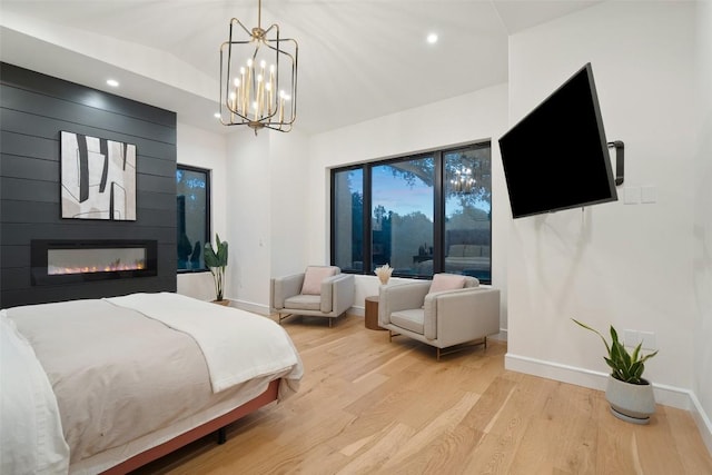 11420 Rim Rock Trl, Austin, TX 78737 - bedroom with light wood finished floors, recessed lighting, a fireplace, and a chandelier