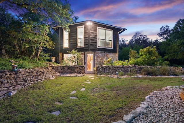 11420 Rim Rock Trl, Austin, TX 78737 - view of property exterior with stone siding and a yard