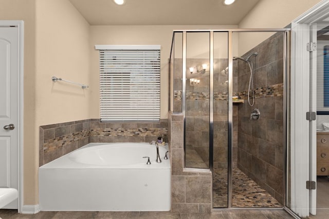 12417 Mediterra Pl, Austin, TX 78732 - bathroom featuring a bath, a stall shower, and recessed lighting
