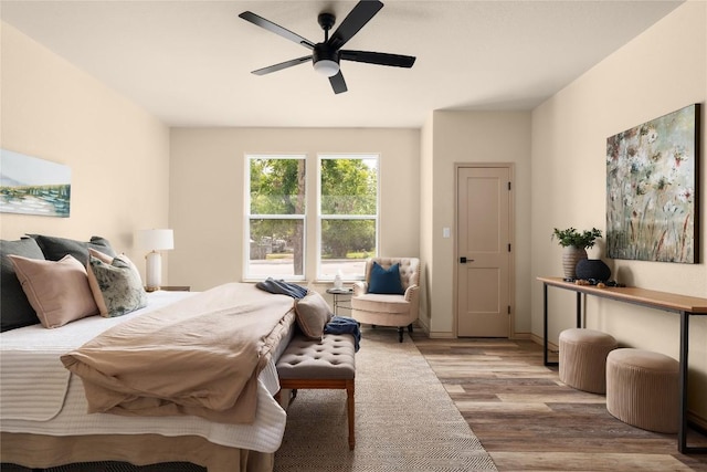 417 S Blanco St, Lockhart, TX 78644 - bedroom with wood finished floors and ceiling fan