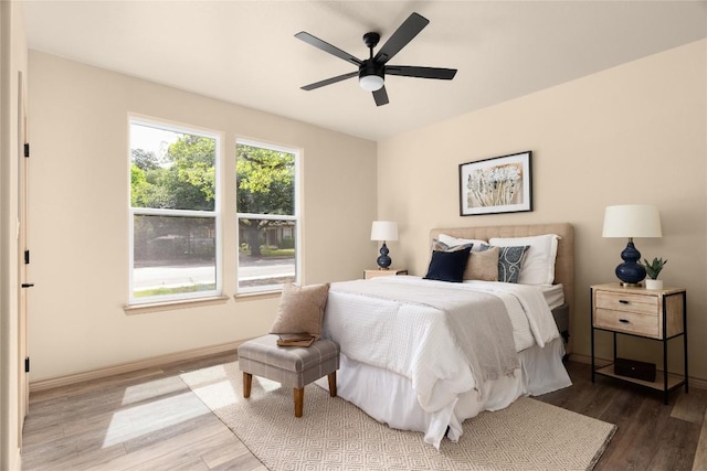 417 S Blanco St, Lockhart, TX 78644 - bedroom with wood finished floors and ceiling fan