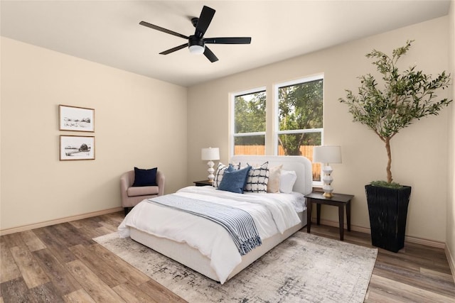 417 S Blanco St, Lockhart, TX 78644 - bedroom with wood finished floors and a ceiling fan