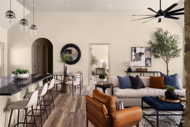 417 S Blanco St, Lockhart, TX 78644 - living room featuring arched walkways, wood finished floors, a ceiling fan, and high vaulted ceiling