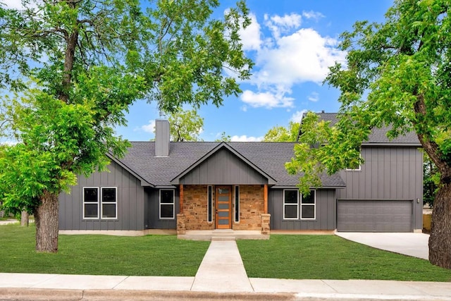 417 S Blanco St, Lockhart, TX 78644 - view of front facade with roof with shingles, driveway, a front lawn, and a chimney