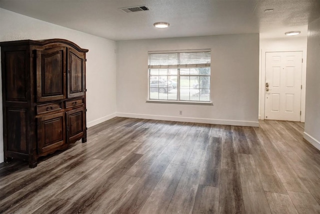 742 Annika Way, Bastrop, TX 78602 - unfurnished room with dark wood-type flooring and baseboards